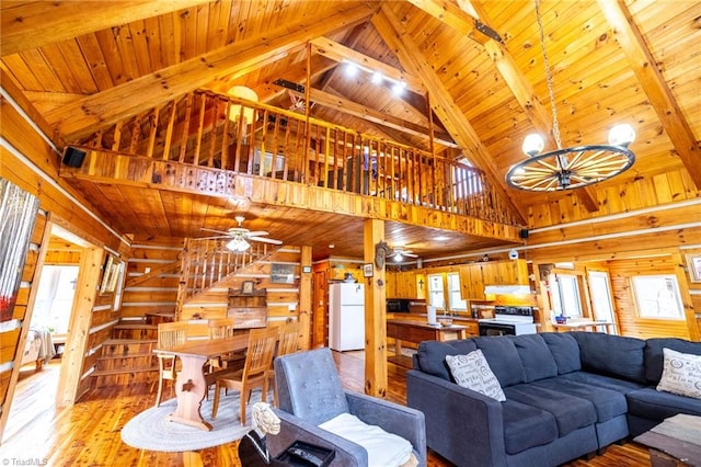 living area with wooden ceiling, ceiling fan, light wood-style floors, and a wealth of natural light