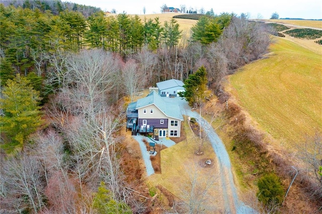 birds eye view of property with a rural view