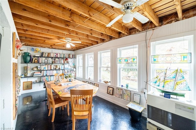 dining area featuring ceiling fan and baseboards