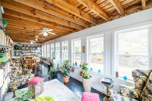 sunroom / solarium featuring ceiling fan