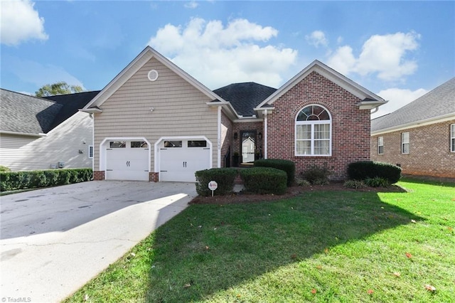 view of front of property featuring driveway, a garage, a front lawn, and brick siding