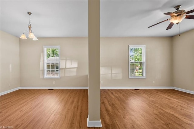 810 Mobile St, High Point, NC 27262 - empty room with healthy amount of natural light, wood finished floors, and baseboards