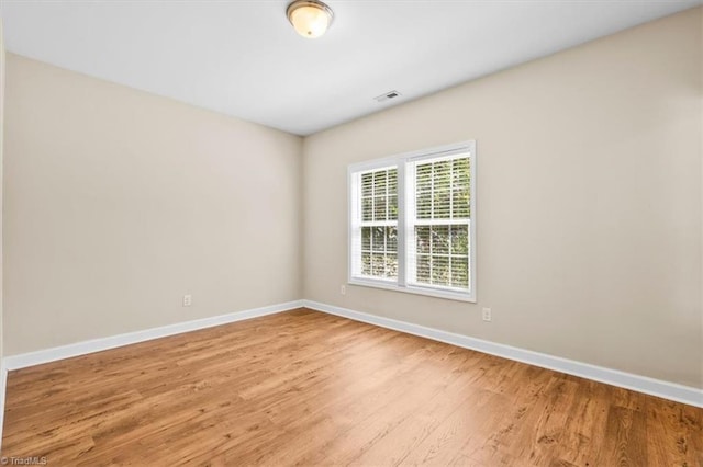 810 Mobile St, High Point, NC 27262 - empty room with baseboards and light wood-type flooring