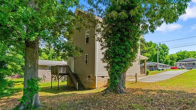 810 Mobile St, High Point, NC 27262 - view of side of home with crawl space, stairs, a lawn, and a wooden deck