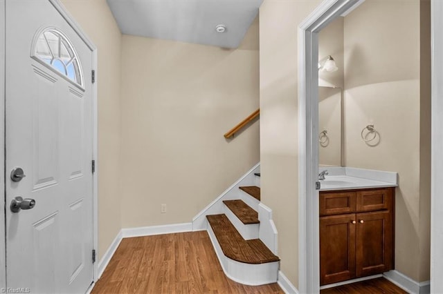 810 Mobile St, High Point, NC 27262 - entryway with wood finished floors, stairway, and baseboards