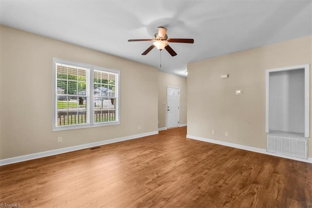 810 Mobile St, High Point, NC 27262 - spare room featuring a ceiling fan, wood finished floors, and baseboards