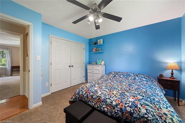 4012 Clarendon Ave, Winston-Salem, NC 27106 - bedroom featuring carpet, a textured ceiling, a closet, and a ceiling fan