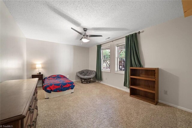 4012 Clarendon Ave, Winston-Salem, NC 27106 - carpeted bedroom with a textured ceiling and a ceiling fan