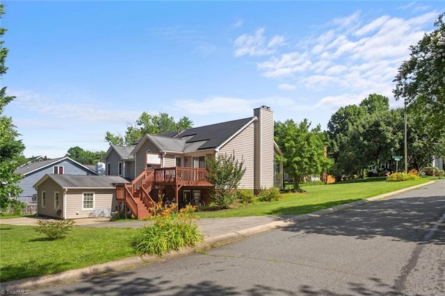 4012 Clarendon Ave, Winston-Salem, NC 27106 - view of front of home featuring a wooden deck, a front yard, stairway, and a chimney