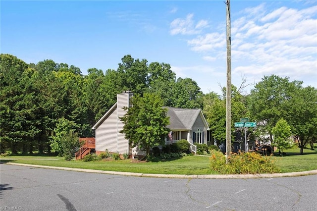 4012 Clarendon Ave, Winston-Salem, NC 27106 - view of side of property with a lawn and a chimney
