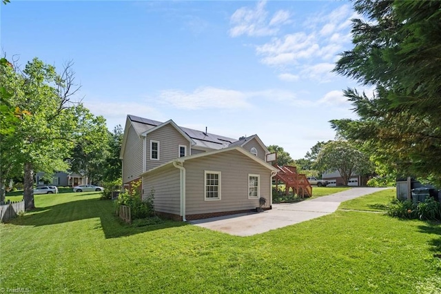 4012 Clarendon Ave, Winston-Salem, NC 27106 - view of property exterior with a yard, a patio area, and solar panels