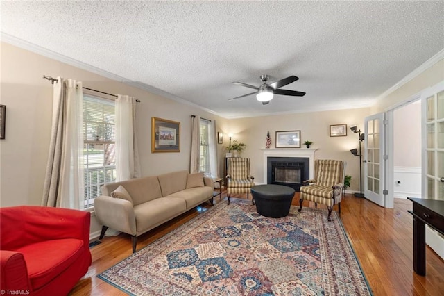 4012 Clarendon Ave, Winston-Salem, NC 27106 - living area with crown molding, a textured ceiling, wood finished floors, ceiling fan, and french doors