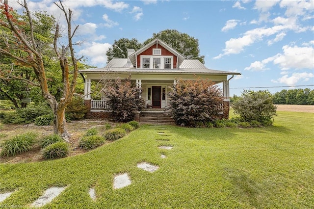 20155 S NC Highway 109, Denton, NC 27239 - view of front of house with a front lawn, covered porch, a chimney, and metal roof