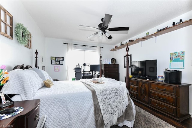 bedroom with dark wood finished floors and a ceiling fan