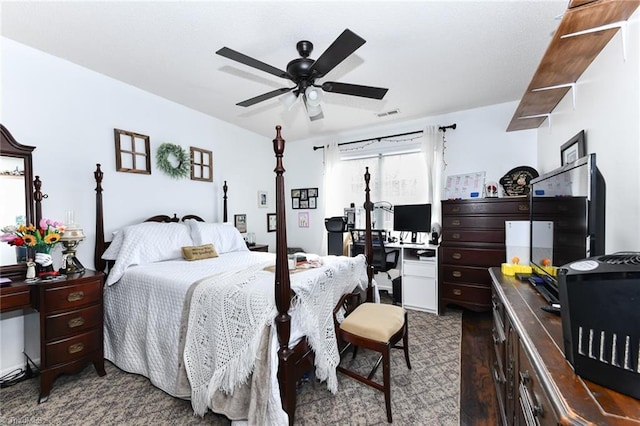 bedroom featuring visible vents, wood finished floors, and a ceiling fan