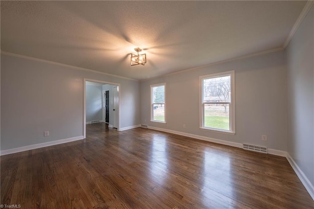 spare room with crown molding and dark hardwood / wood-style floors