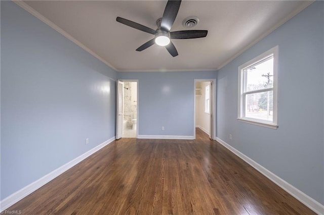 unfurnished room featuring ceiling fan, crown molding, and dark wood-type flooring