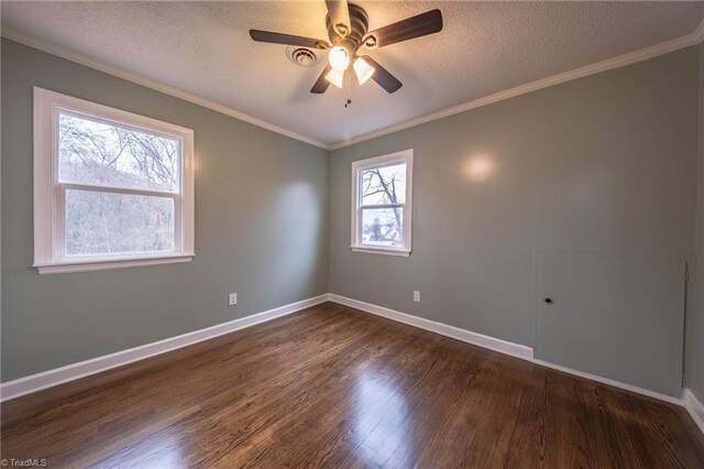 unfurnished room featuring a textured ceiling, ceiling fan, crown molding, and dark wood-type flooring