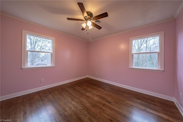 unfurnished room featuring ceiling fan, crown molding, and dark wood-type flooring