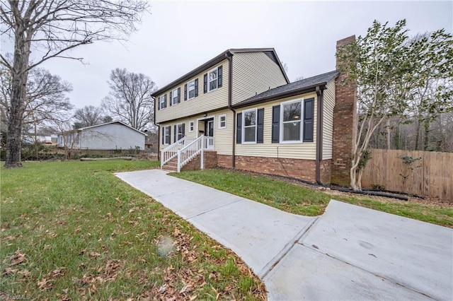 front facade featuring a front lawn