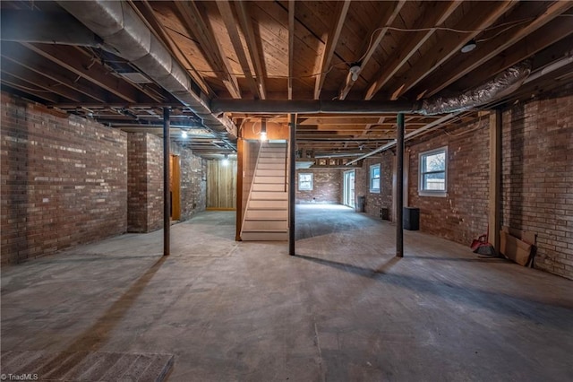 basement with brick wall