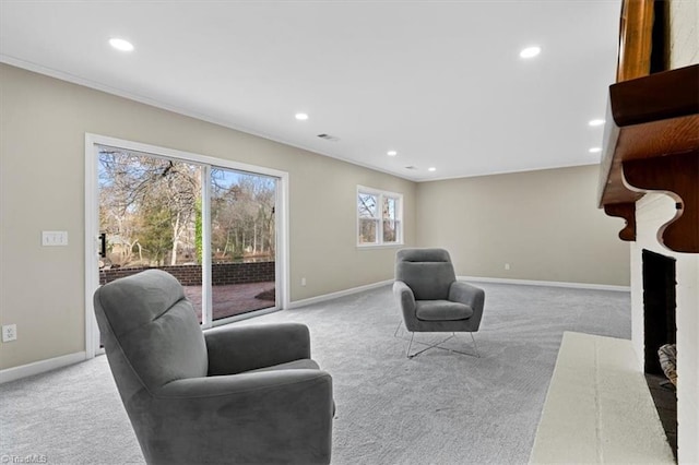 carpeted living room with recessed lighting and baseboards