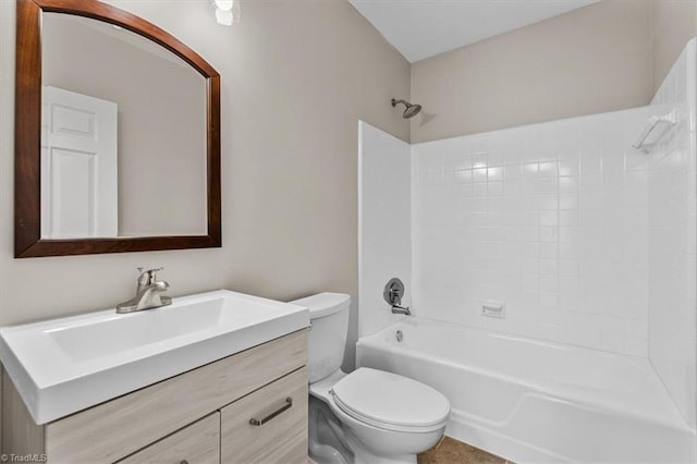 full bath with shower / tub combination, vanity, and toilet