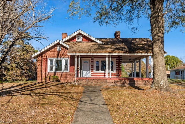 view of front of property featuring covered porch