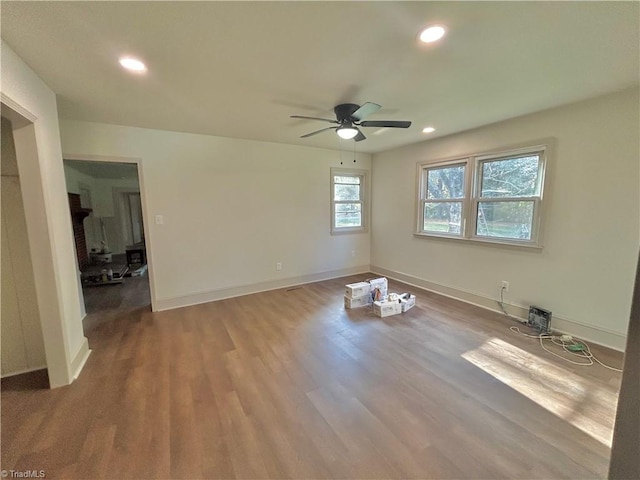 empty room featuring hardwood / wood-style floors and ceiling fan