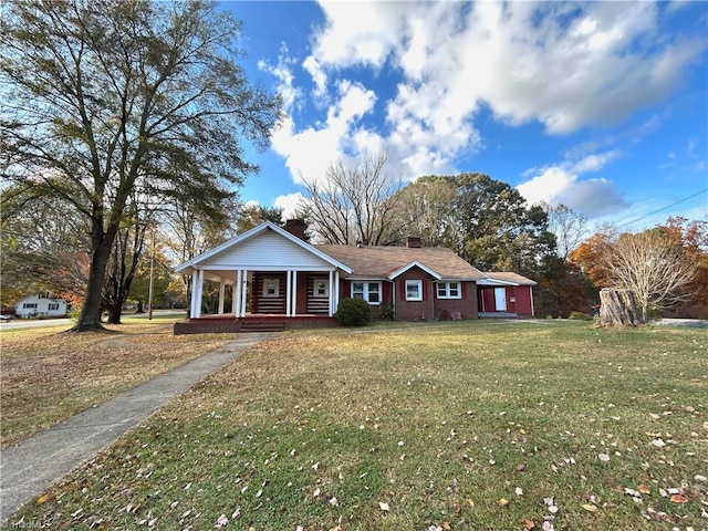 single story home with covered porch and a front lawn