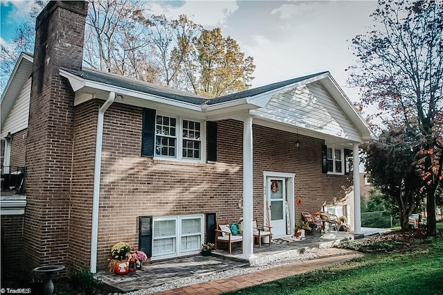 back of property featuring a patio