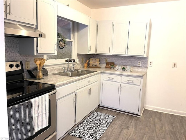 kitchen with extractor fan, dark wood-type flooring, sink, electric stove, and white cabinets