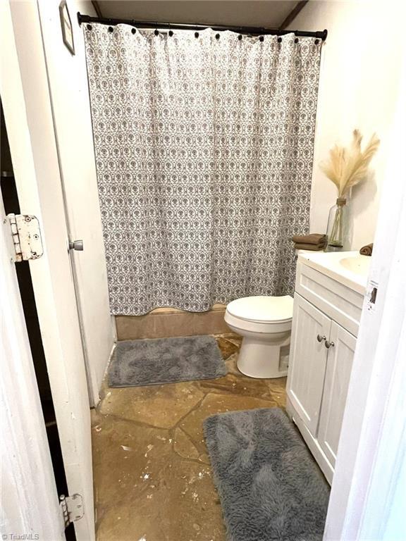 bathroom with vanity and toilet