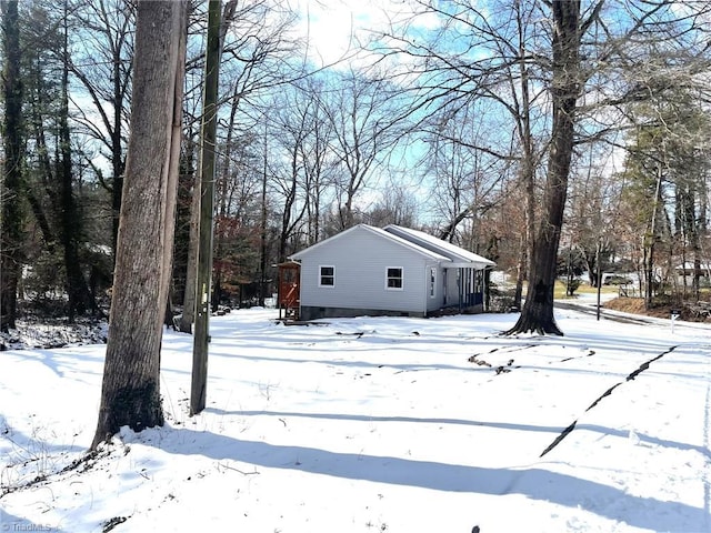 view of yard layered in snow