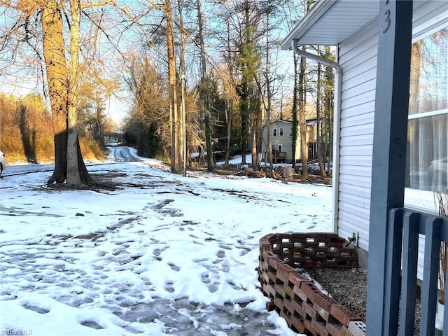 view of yard layered in snow