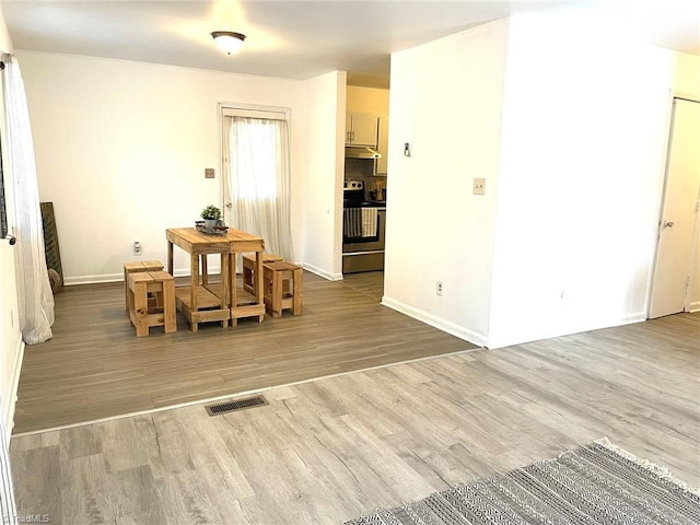 dining area with hardwood / wood-style flooring