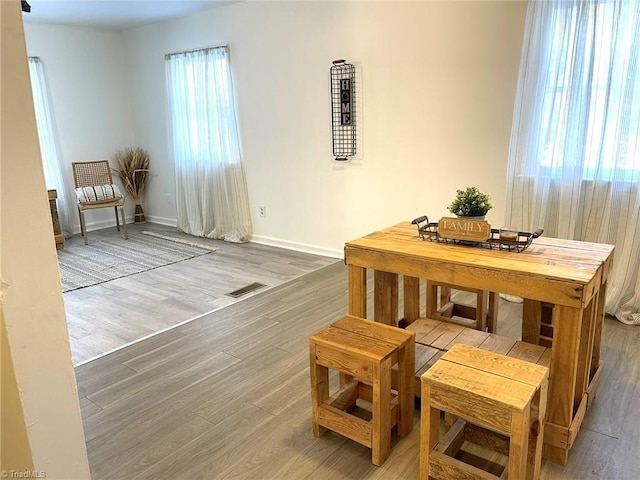 sitting room with wood-type flooring