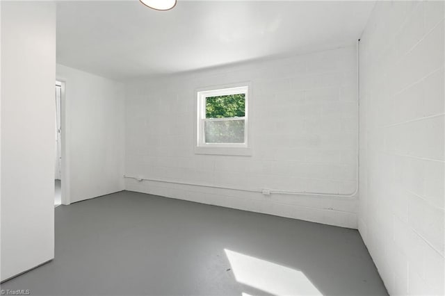 spare room featuring finished concrete floors