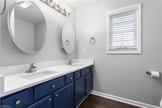 bathroom featuring vanity and hardwood / wood-style flooring