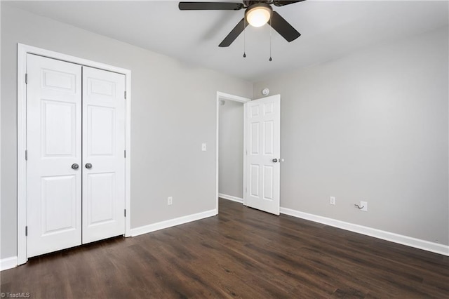 unfurnished bedroom with a closet, ceiling fan, and dark hardwood / wood-style floors