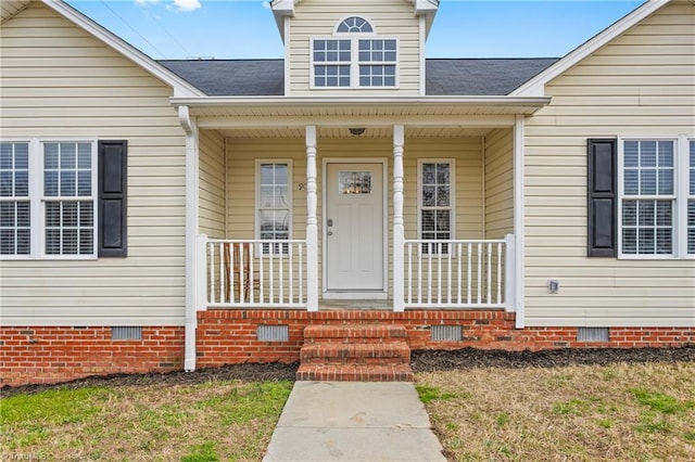 doorway to property featuring a porch