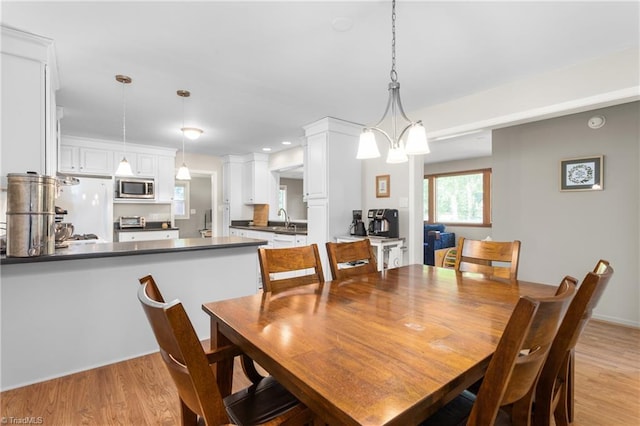 2909 Shamrock Dr, Greensboro, NC 27408 - dining space featuring light wood-style floors