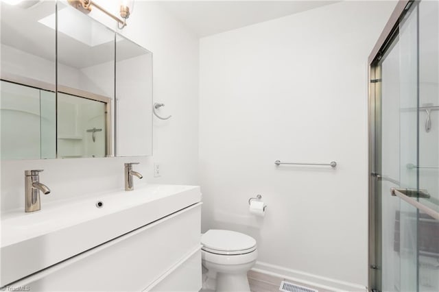 2909 Shamrock Dr, Greensboro, NC 27408 - full bathroom with toilet, a shower stall, baseboards, and vanity