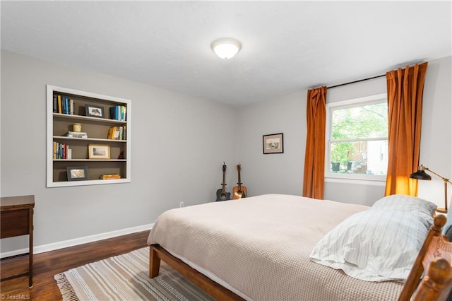 2909 Shamrock Dr, Greensboro, NC 27408 - bedroom featuring wood finished floors and baseboards