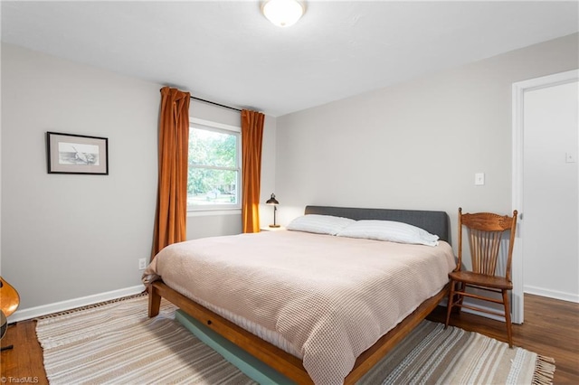 2909 Shamrock Dr, Greensboro, NC 27408 - bedroom featuring baseboards and wood finished floors