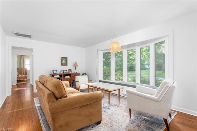 2909 Shamrock Dr, Greensboro, NC 27408 - living area with baseboards and wood finished floors