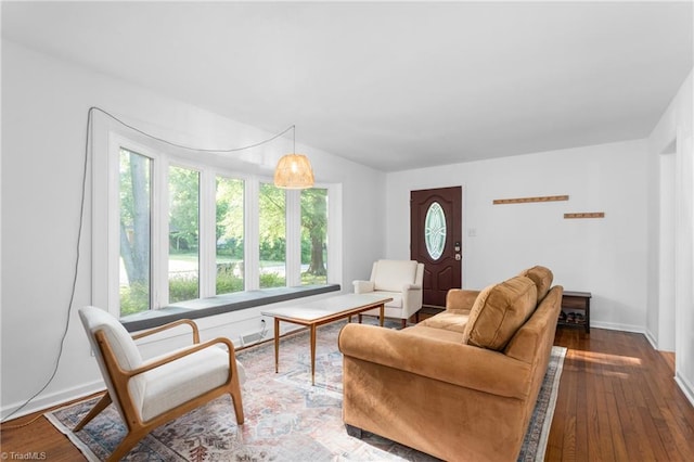 2909 Shamrock Dr, Greensboro, NC 27408 - living area featuring plenty of natural light, dark wood finished floors, and baseboards