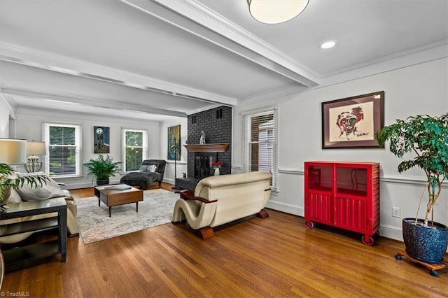 1608 Fox Hollow Rd, Greensboro, NC 27410 - living room featuring wood finished floors, healthy amount of natural light, beam ceiling, a fireplace, and crown molding
