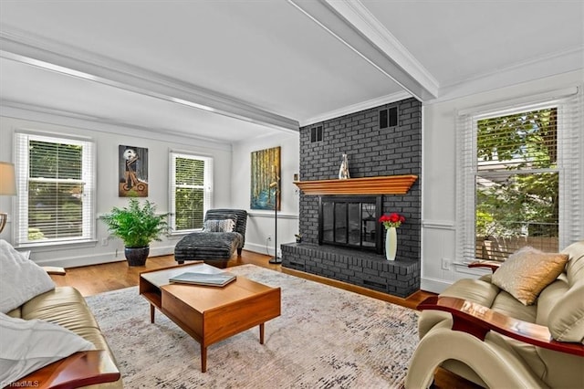 1608 Fox Hollow Rd, Greensboro, NC 27410 - living area featuring crown molding, beam ceiling, wood finished floors, and a fireplace