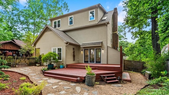 1608 Fox Hollow Rd, Greensboro, NC 27410 - back of property featuring a wooden deck, a fenced backyard, and roof with shingles